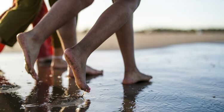 A walk on the beach after a pedicure could expose you to infections