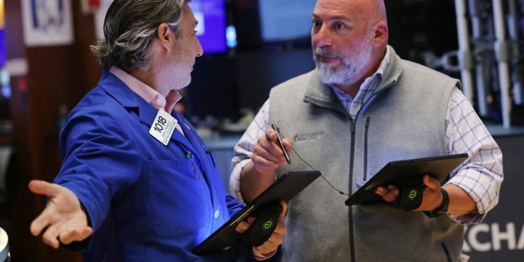 Stocks hit records on shrinking service economy and rising jobless claims