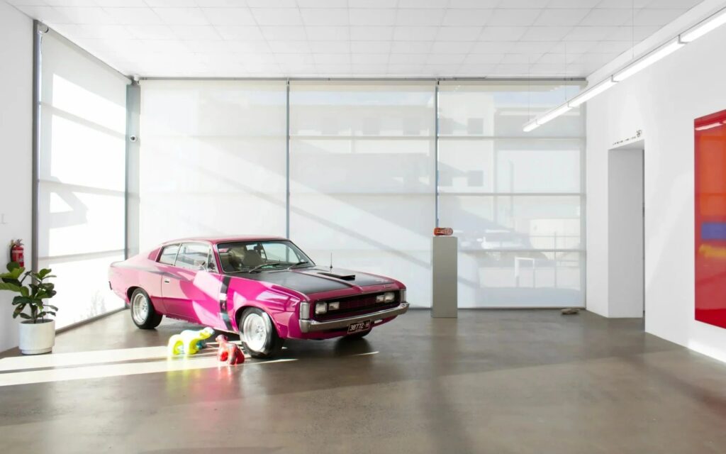 Scott Redford, 'Auto Rothkos', installation view at NAP Contemporary in Mildura, one of the new regional galleries. A minimalistic space with a hot pink care to the left hand side.