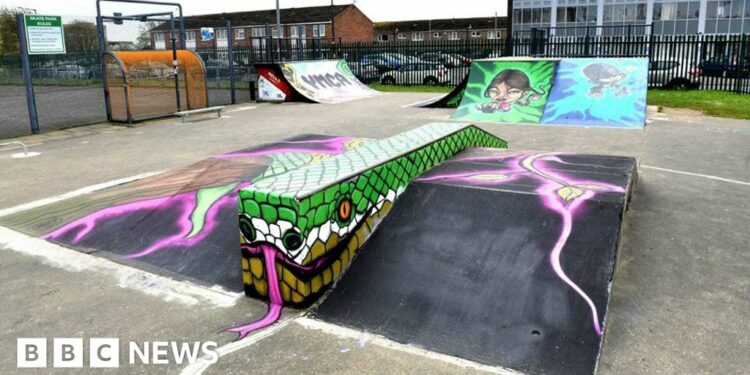 The newly refurbished skate park with ramps painted with colourful graffiti style graphics